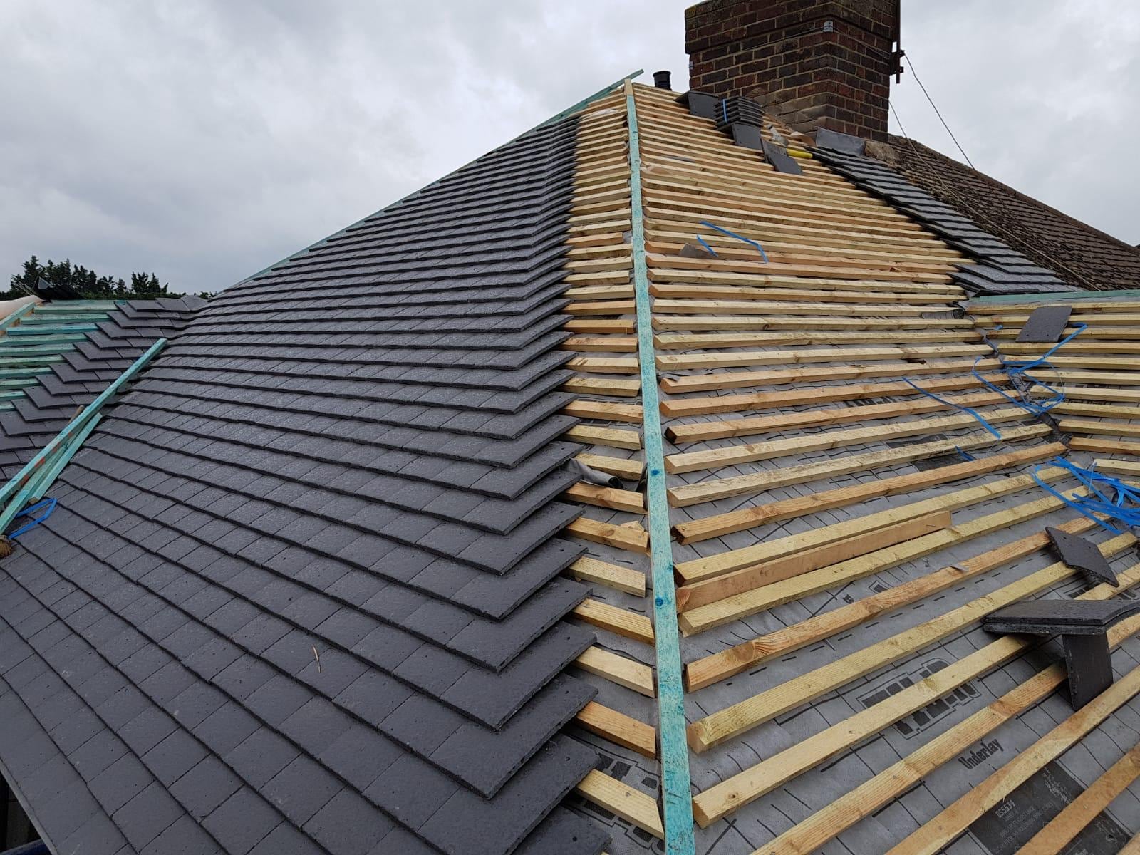Slate re-roof in progress showing new battens, membrane and chimney