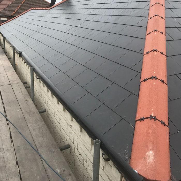 New slate roof finished with red clay ridge tiles